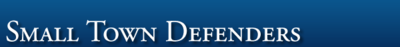 Logo-smalltowndefenders-com.png